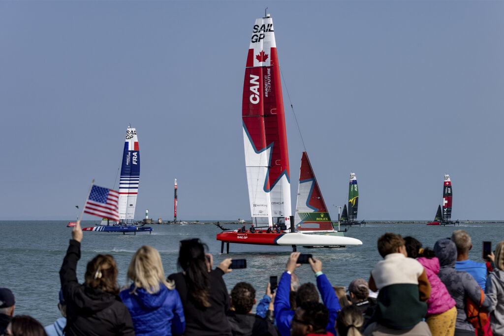 crowd cheers for canadian sailboat