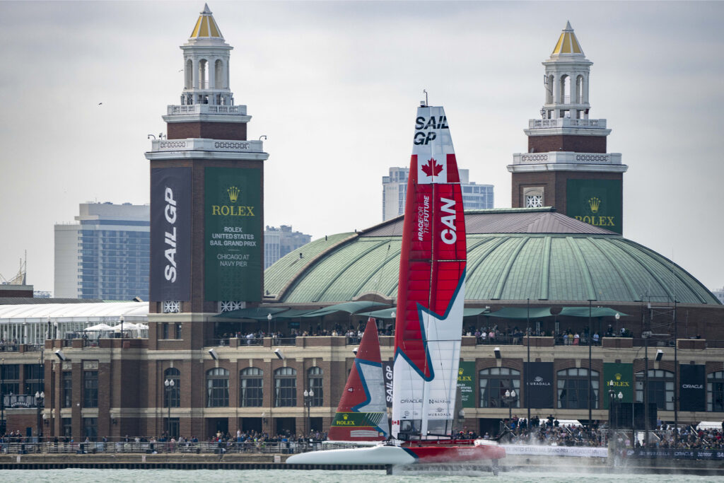 Canada-branded sail framed by cityscape view form harbour