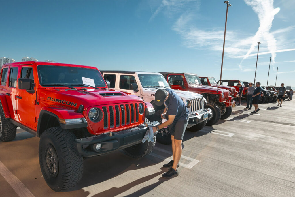 a lineup of parked jeep wranglers