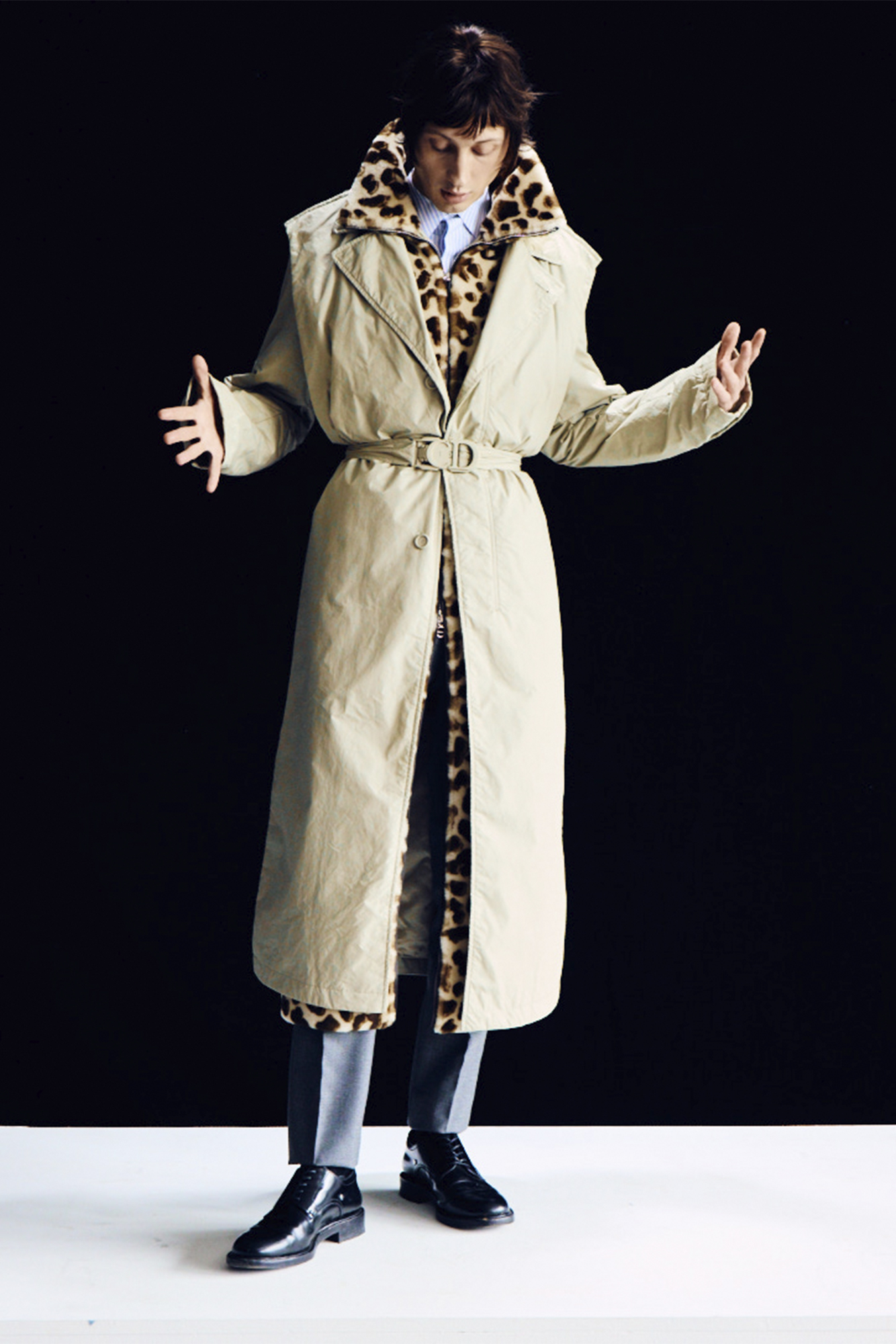 Model for Sharp November in beige trench coat with cheetah print