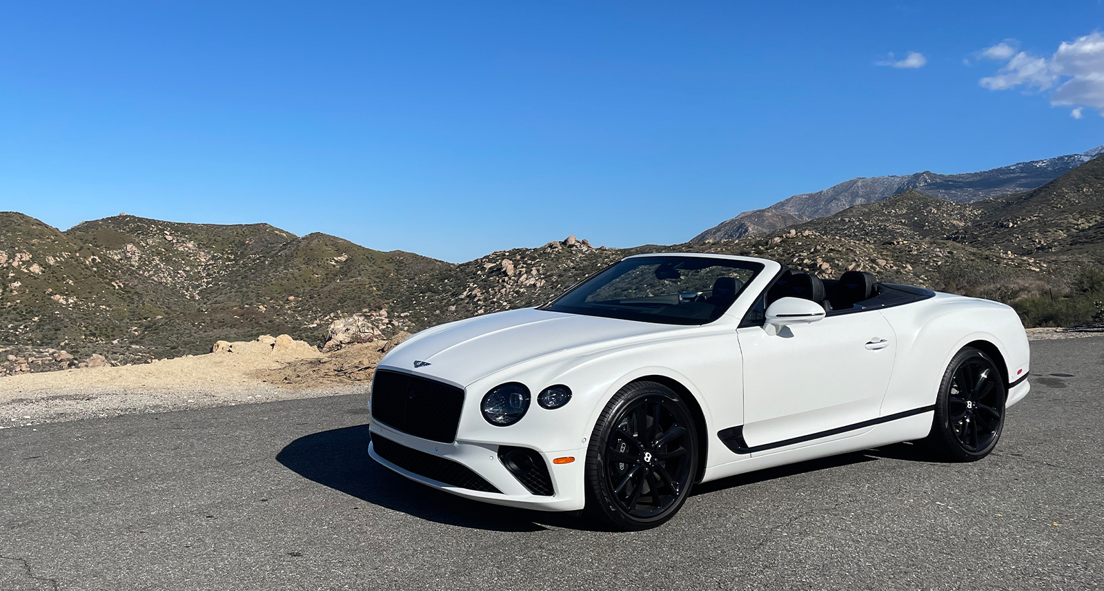 Bentley Continental GTC parked on a mountain ridge