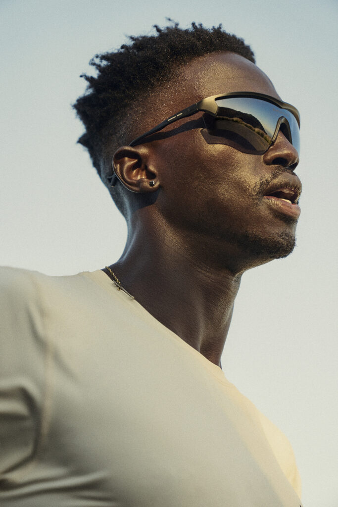 Side profile of a model wearing aviator sunglasses