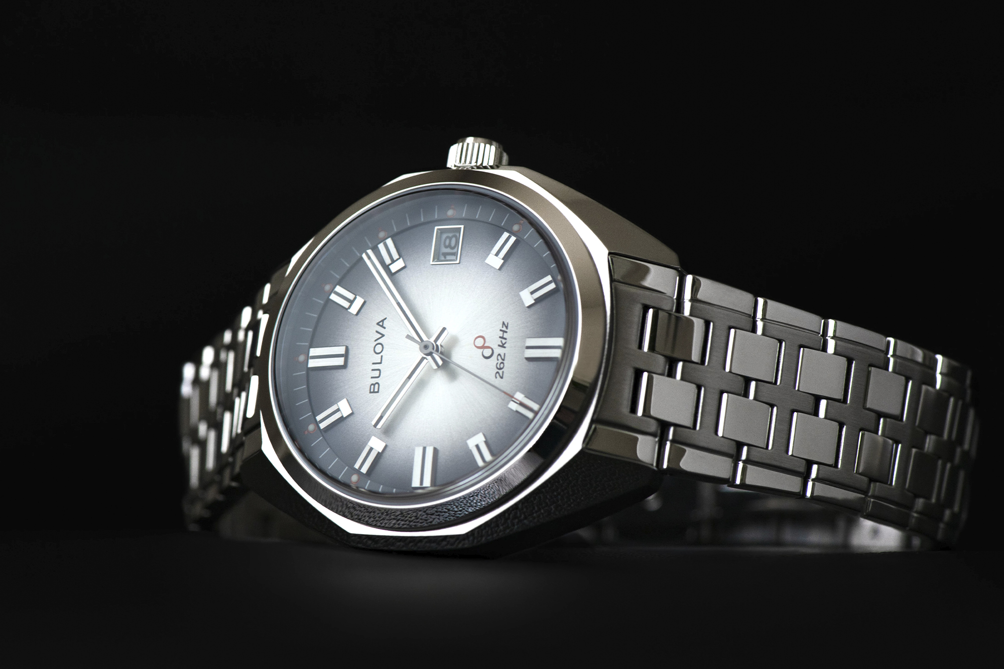 bulova and complecto watch shot with black background