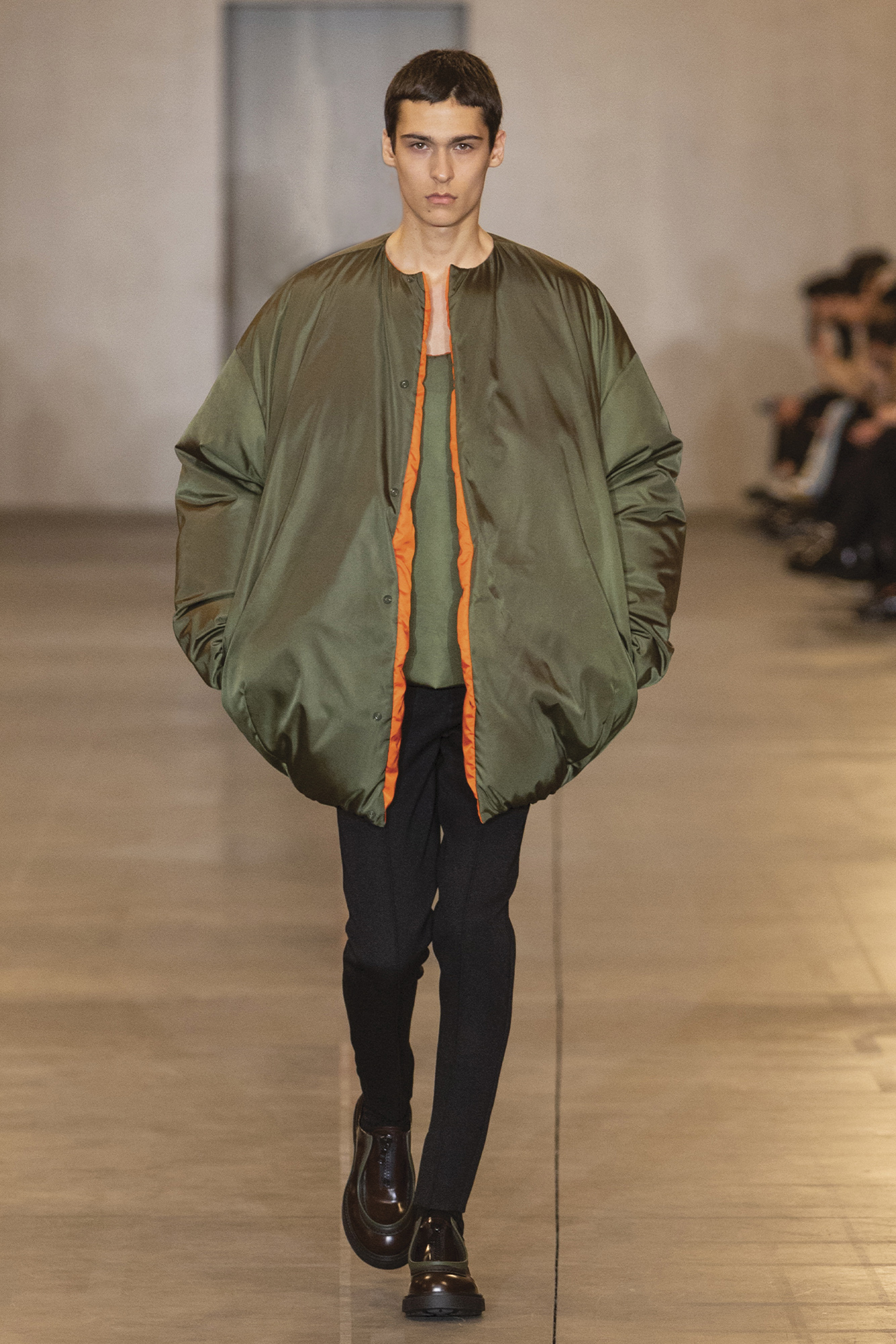 Prada duvet-like jacket in green on runway