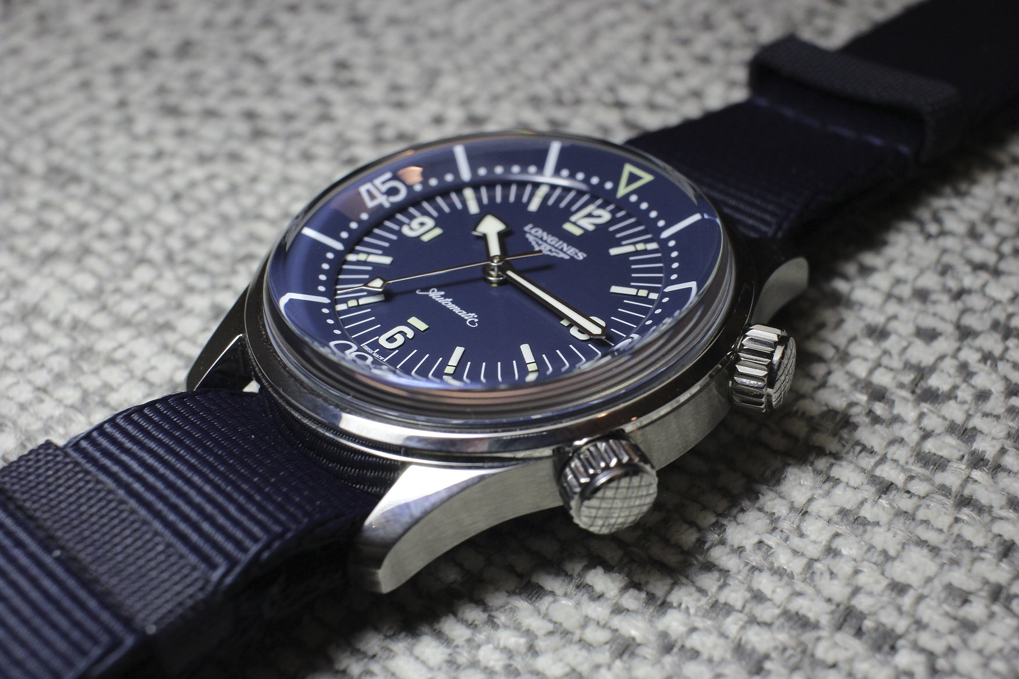 Longines Legend Diver dive watch from side showing blue strap and crown