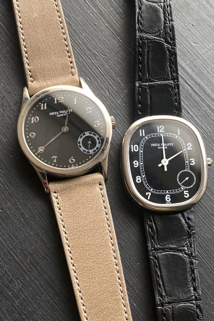 Two watches with black dials