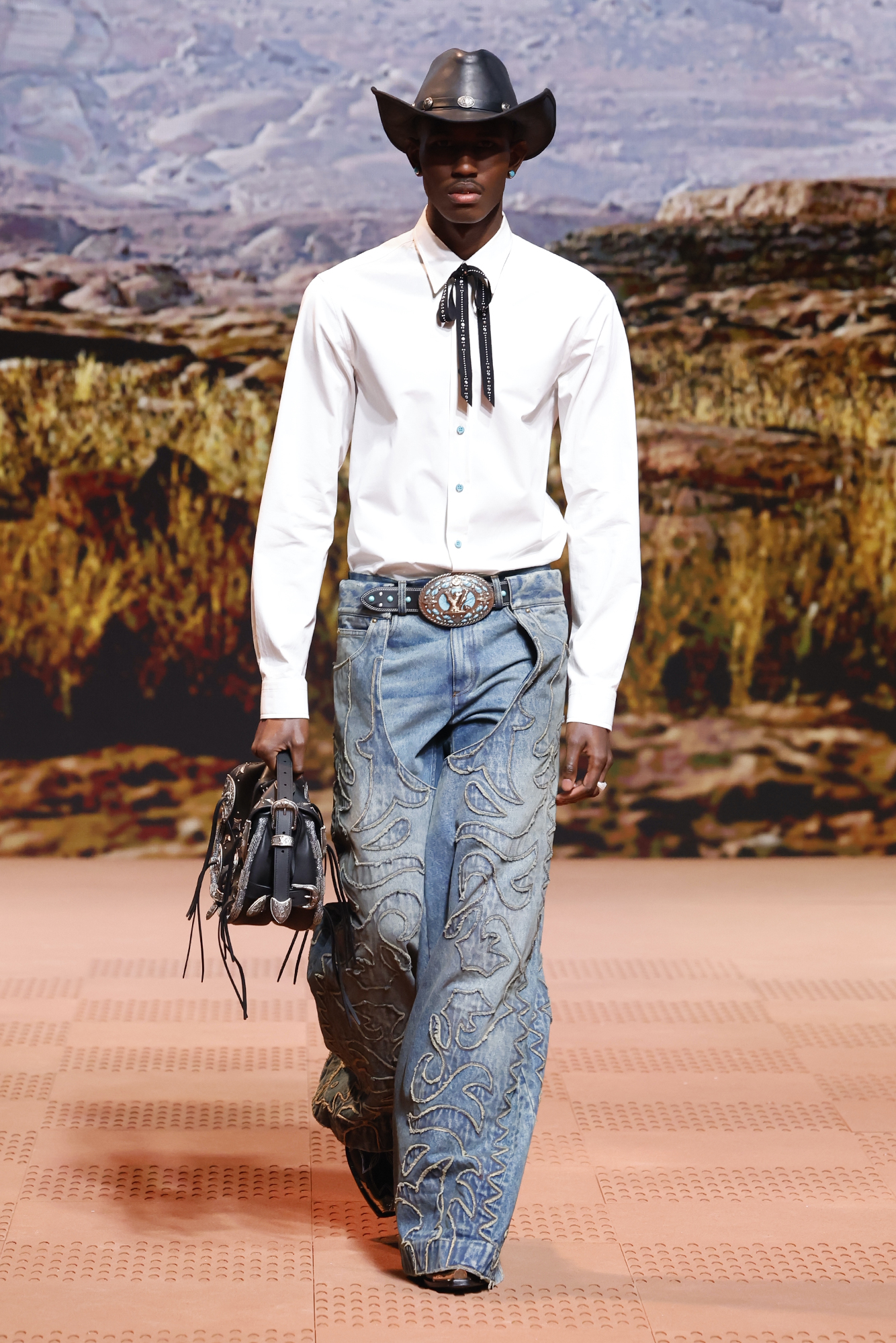 Louis Vuitton Fall/Winter 2024 white button-down and oversized embroidered jeans