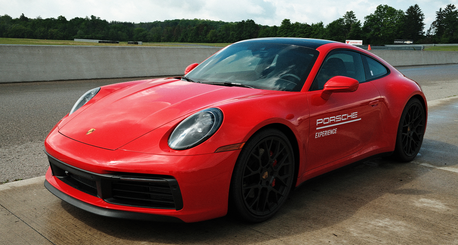 Porsche Drive Track; red car parked
