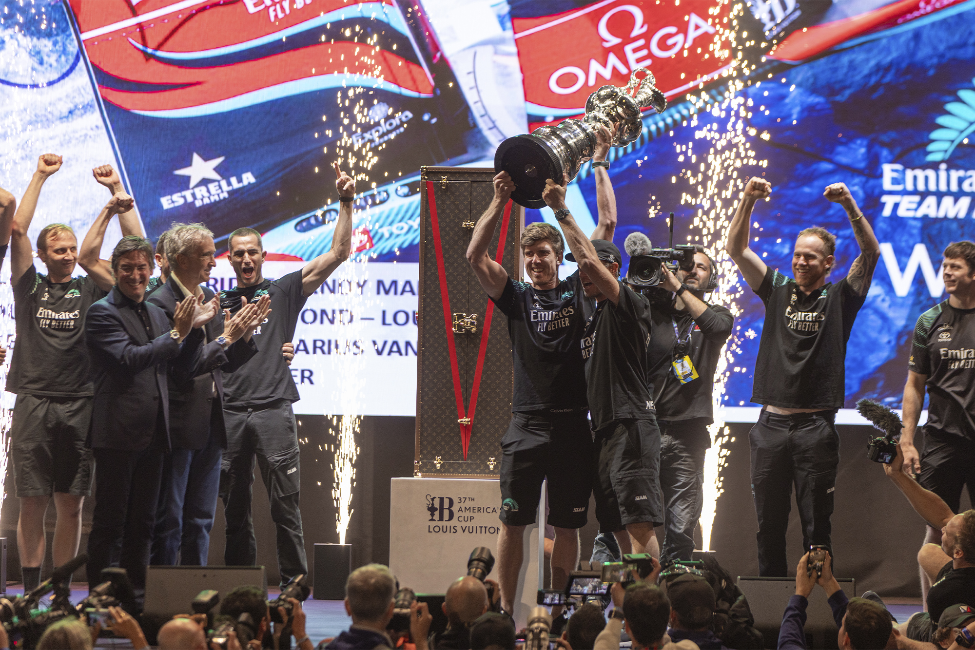 Emirates Team New Zealand accepts the Auld Mug presented by Louis Vuitton for the 37th America's Cup