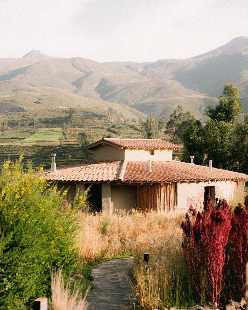 PUQIO Tented Resort in Southern Peru, photo shows rooftop of resort with sunny mountains in back