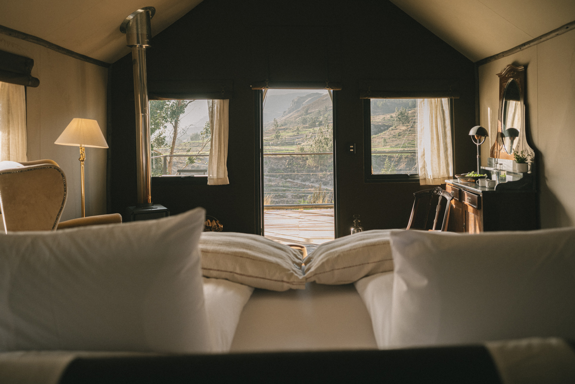 PUQIO Tented Resort in Southern Peru, interior shot of the room showing large windows