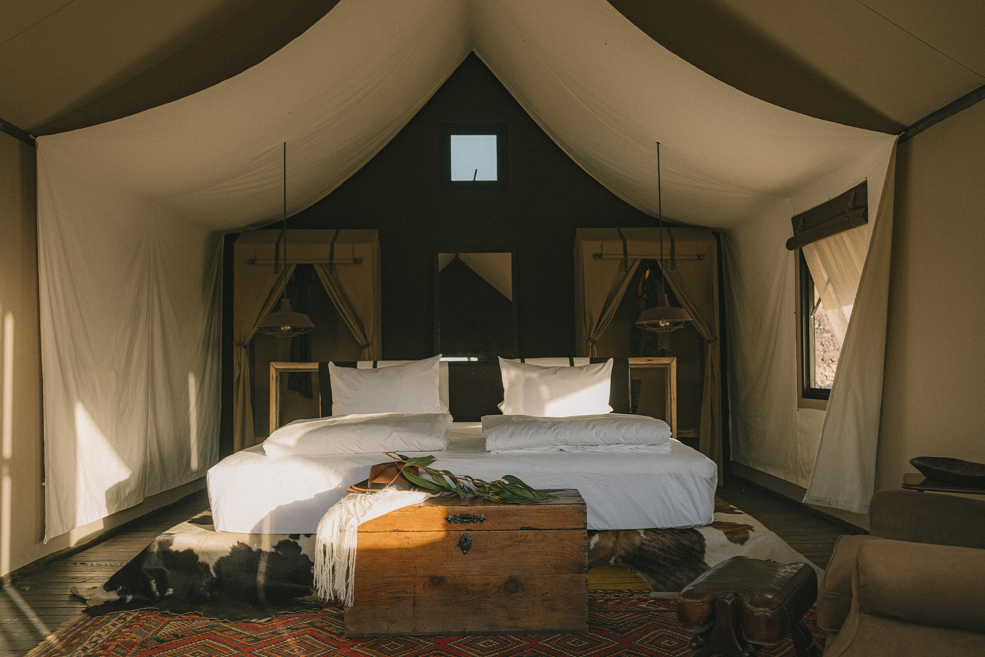 PUQIO Tented Resort in Southern Peru, shot of large bed inside one of the rooms