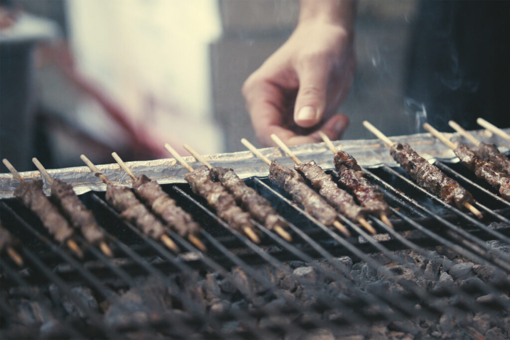 meat grilling on sticks