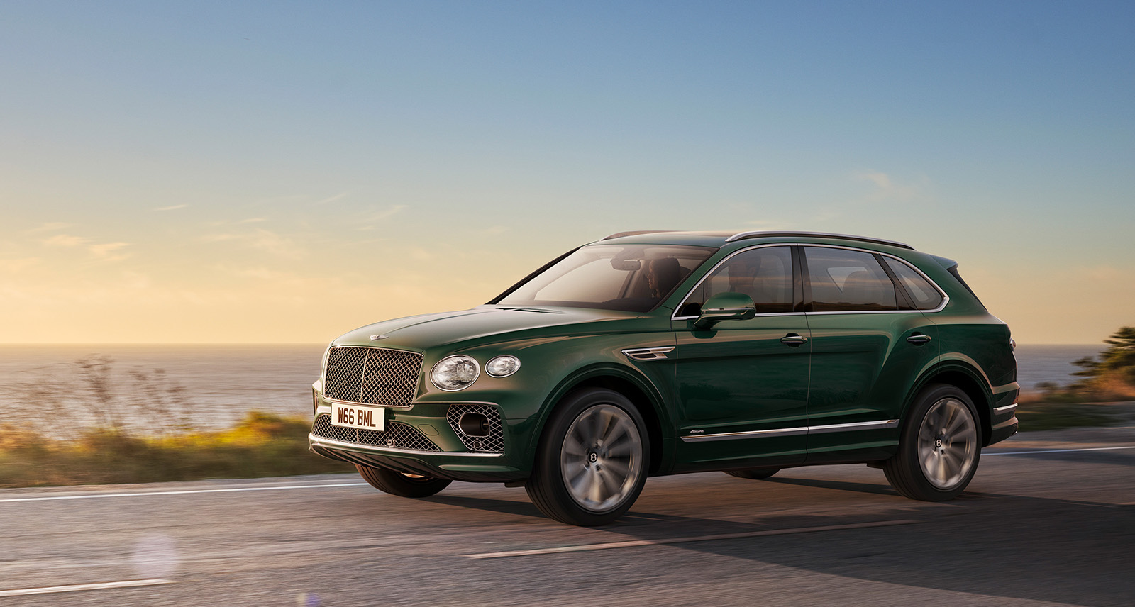 Bentley Bentayga Azure driving into the sunset