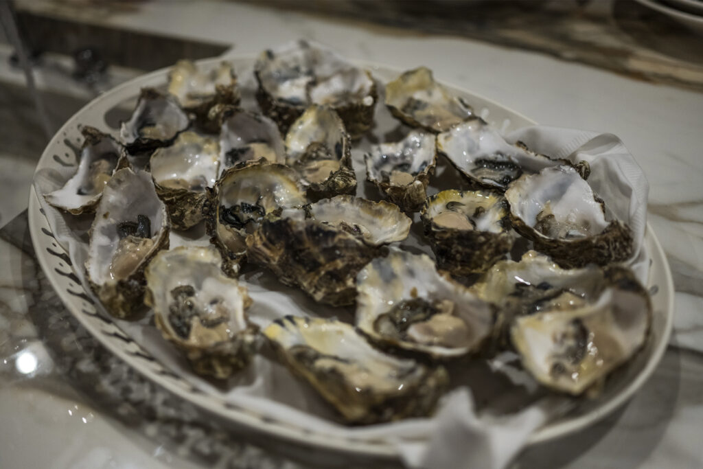 Range Rover House Mykonos Greece Aegean Sea. Oysters on a white plate