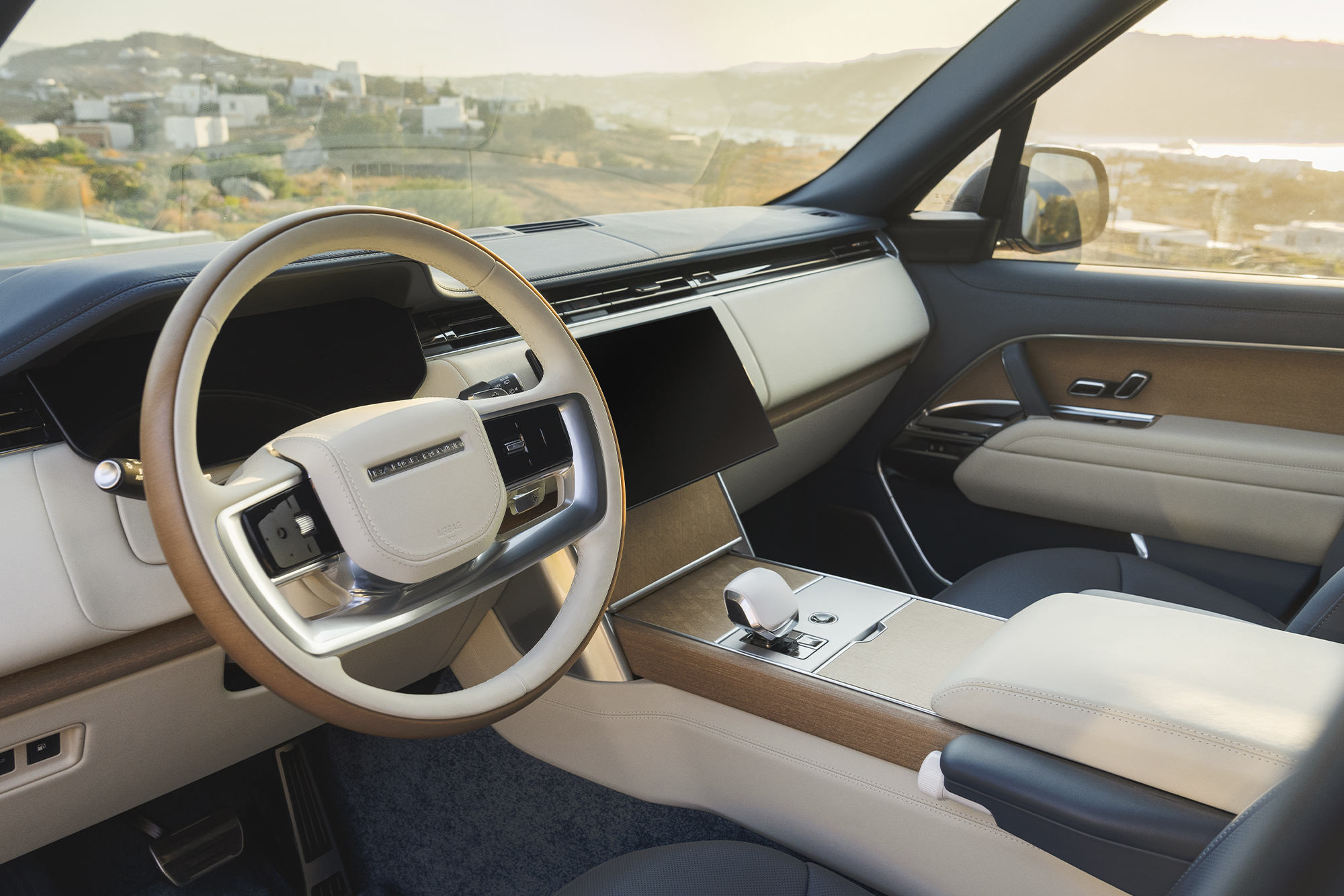 interior shot of the steering wheel and dashboard of a range rover