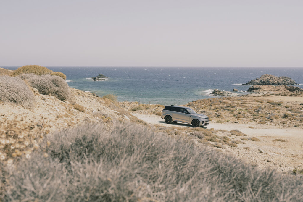 Range Rover drives outside Range Rover house mykonos