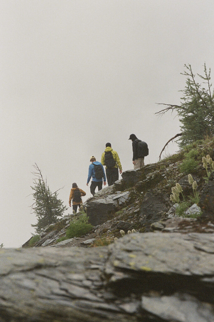 Trip to Alberta to celebrate Citizen Promaster 35-Year Anniversary. four hikers climb a rock face