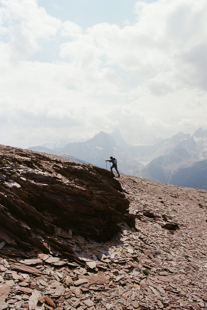 Trip to Alberta to celebrate Citizen Promaster 35-Year Anniversary. a hiker climbs the mountain on a clear day.