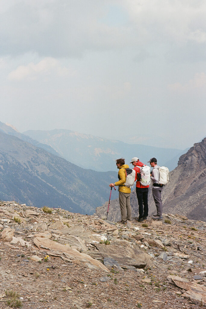 Trip to Alberta to celebrate Citizen Promaster 35-Year Anniversary. a group of hikers look at a view of the rocky mountains