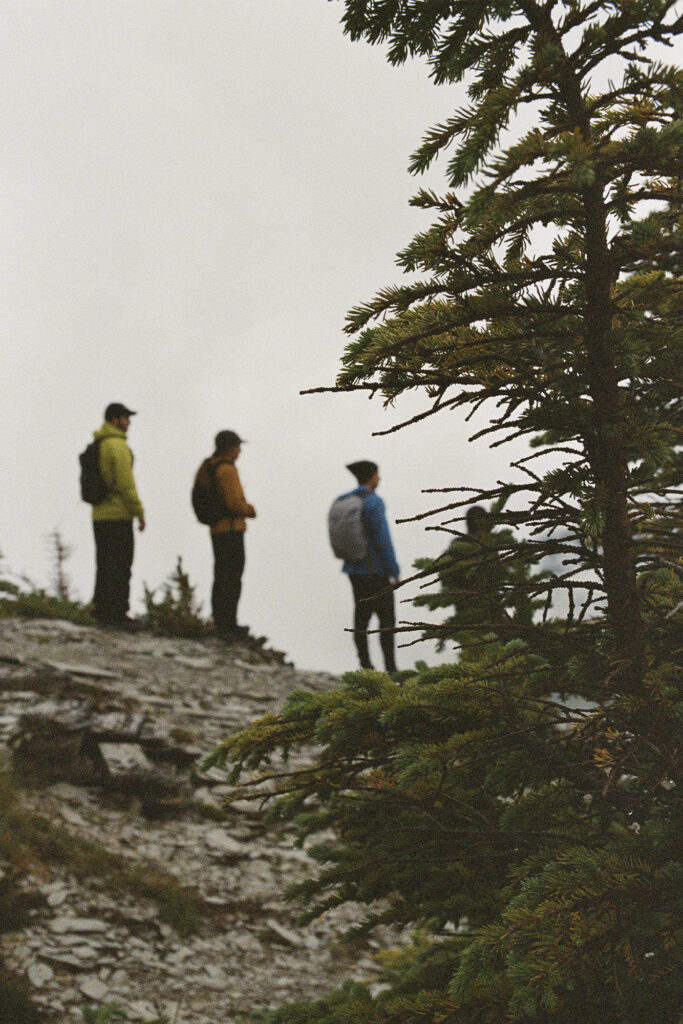 Trip to Alberta to celebrate Citizen Promaster 35-Year Anniversary. a group of men climb a mountain