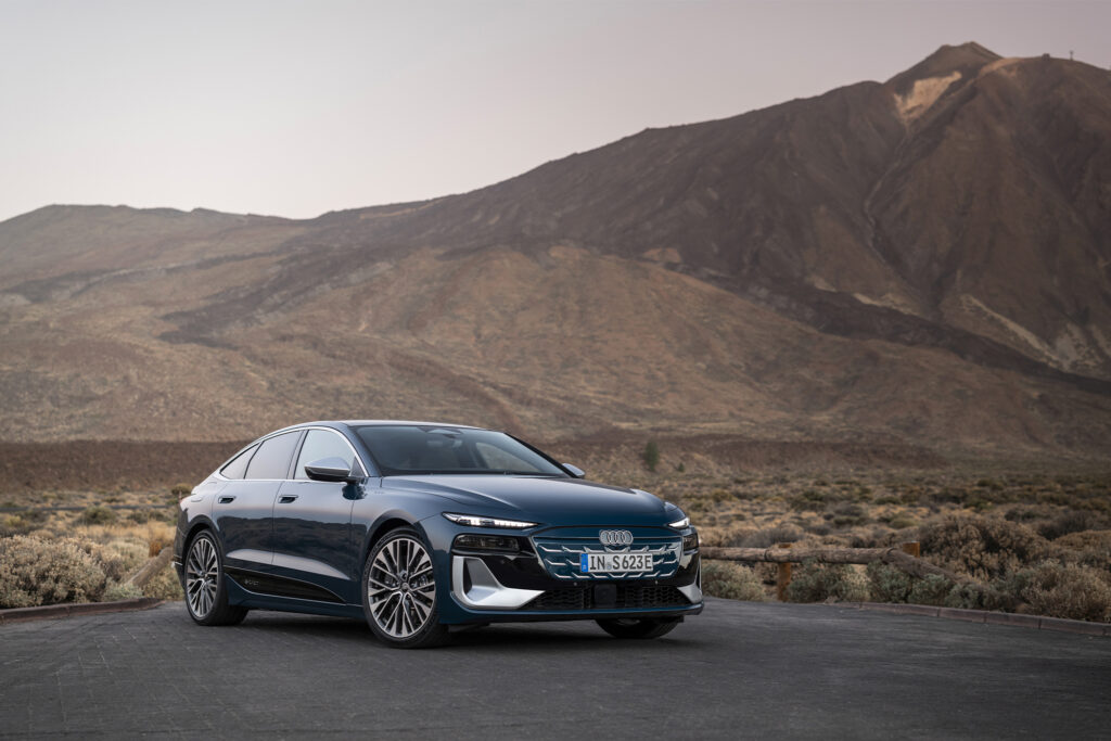 All-Electric Audi A6 e-tron parked with volcano in the background