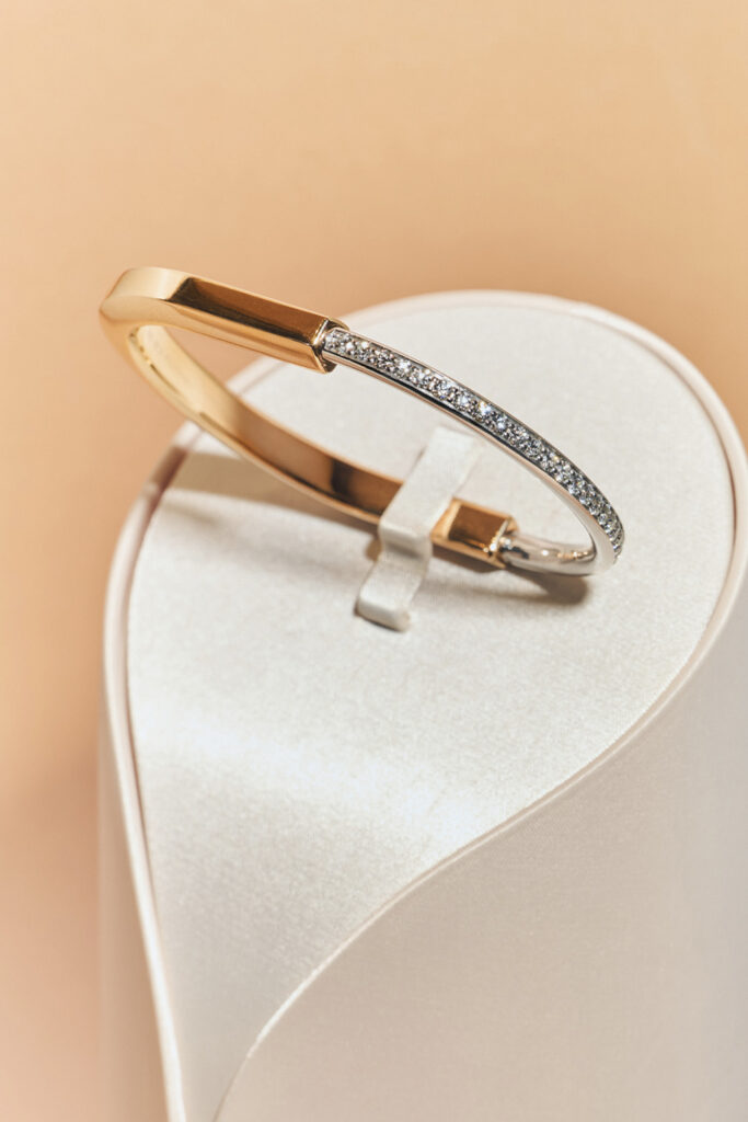 Tiffany Lock narrow bangle in rose and white gold with half pavé diamonds by Tiffany & Co.