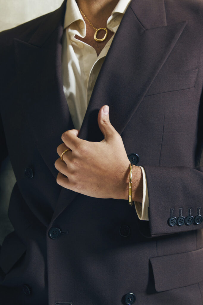 Tiffany Lock large pendant necklace in yellow gold by Tiffany & Co. Tiffany Lock bangle in yellow gold with diamond accents by Tiffany & Co. Tiffany Lock ring in yellow gold with diamonds. Ashkan Hobian for Tiffany & Co. Photography by Sloane Bartley.