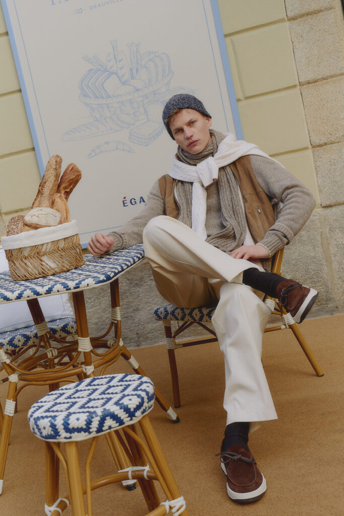 Paul and Shark Men's 2025 Collection model poses inside french bakery