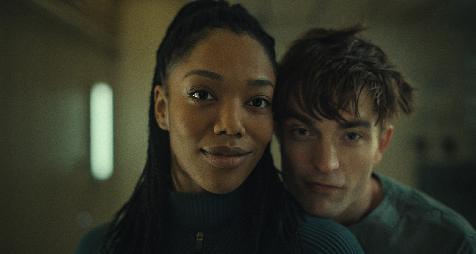 Copyright: © 2025 Warner Bros. Entertainment Inc. All Rights Reserved. Photo Credit: Courtesy of Warner Bros. Picture Caption: (L to r) NAOMI ACKIE as Nasha and ROBERT PATTINSON as Mickey 17 in “MICKEY 17,” a Warner Bros. Pictures release.