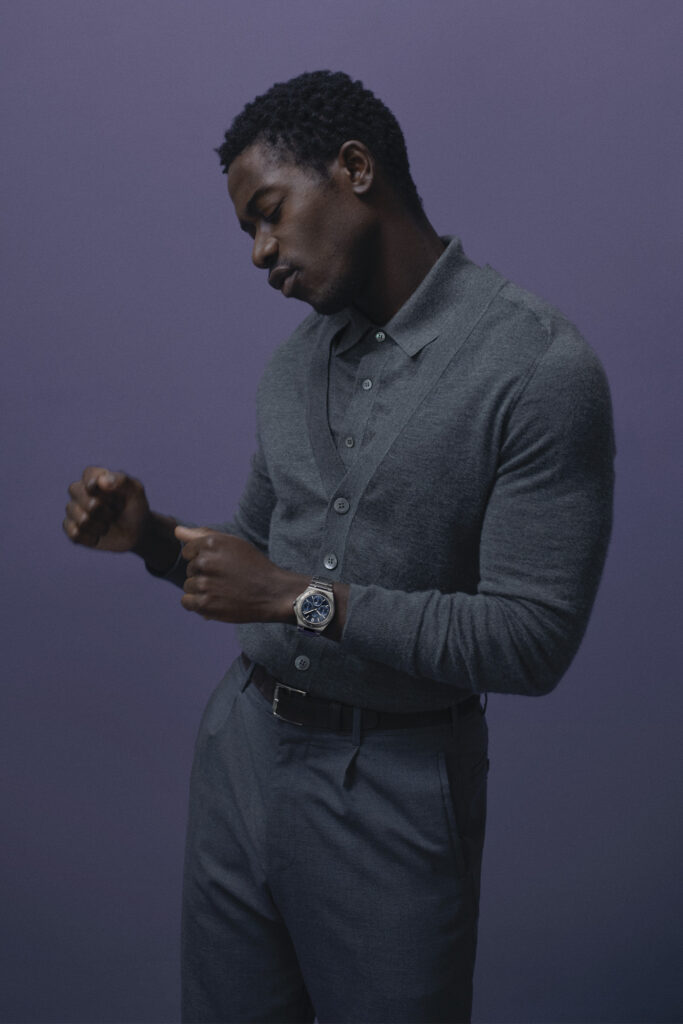 DAMSON IDRIS shot from the side on purple background