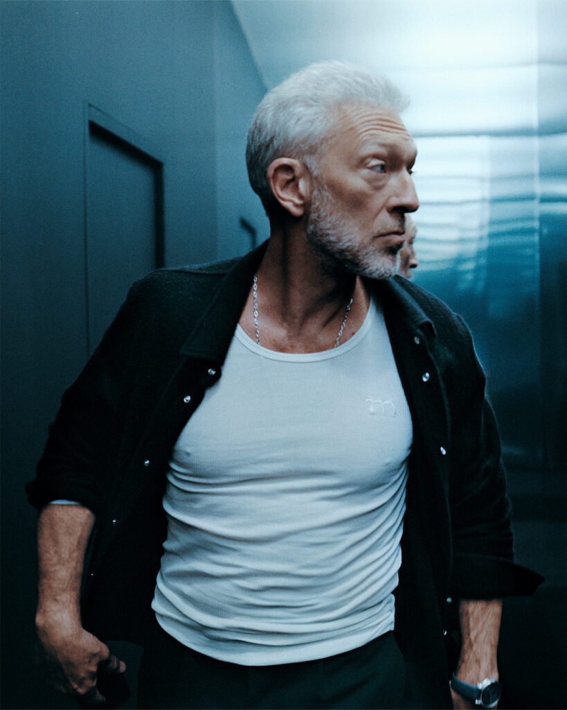 SHIRT BY GOD’S TRUE CASHMERE; TANK BY META CAMPANIA COLLECTIVE; NECKLACE BY CARTIER WATCH BY AUDEMARS PIGUET Vincent Cassel 5-2025 1