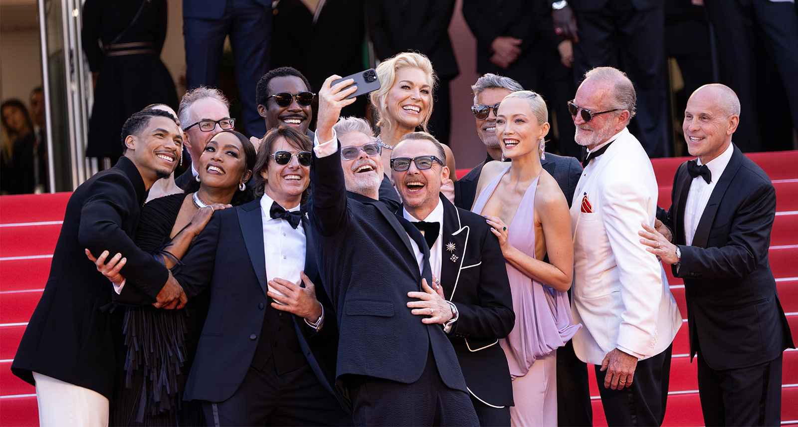 Eddie Hamilton, Greg Tarzan Davis, Hayley Atwell, Angela Bassett, Tom Cruise, Tramell Tillman, Christopher McQuarrie, Simon Pegg, Hannah Waddingham, Pom Klementieff, Esai Morales, Brian Robbins and Erik Jendresen attend the "Mission Impossible - The Final Reckoning" red carpet at the 78th annual Cannes Film Festival 2025