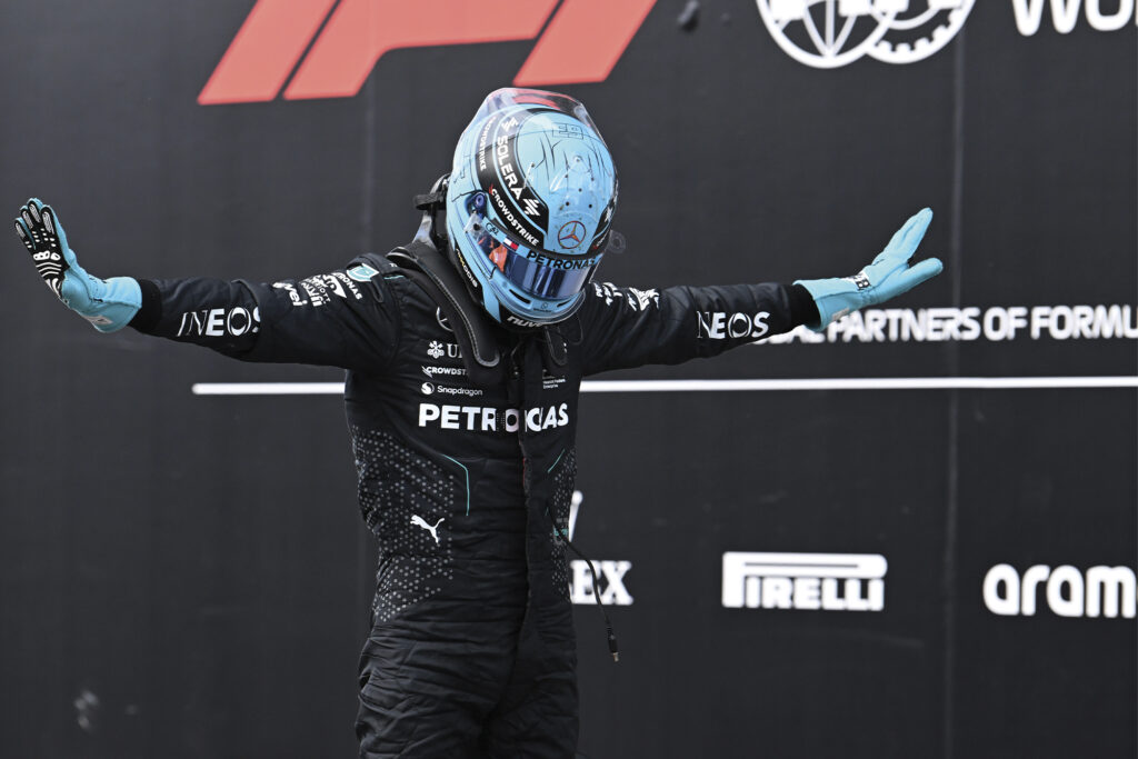 Fact of Fiction: Driver's love montreal. Image shows an f1 driver posing in front of a wall