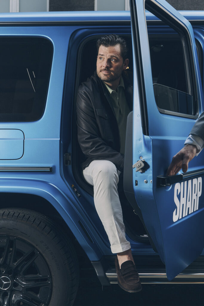Rob Rossi gets out of car wearing LEATHER BOMBER JACKET BY CANALI; GARMENT-DYED HONEYCOMB KNIT POLO BY MAURIZIO BALDASSARI; SLIM-FIT STRETCH-COTTON CHINOS BY BRIGLIA.
FULL LOOK AT HARRY ROSEN.