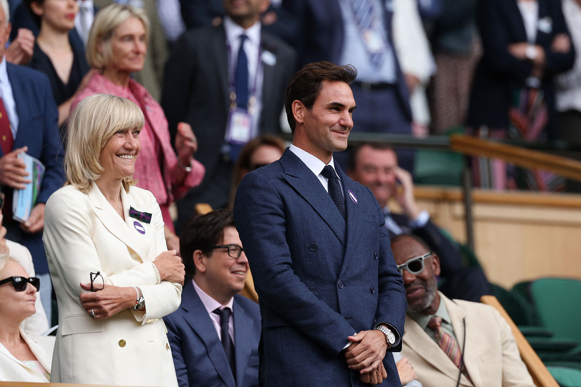 Switzerland's Roger Federer is seen on the Royal box of Centre court at the end of the men's singles fourth round tennis match between Australia's Alex De Minaur and Serbia's Novak Djokovic on the eighth day of the 2025 Wimbledon Championships at The All England Lawn Tennis and Croquet Club in Wimbledon, southwest London, on July 7, 2025. (Photo by Adrian Dennis / AFP) / RESTRICTED TO EDITORIAL USE (Photo by ADRIAN DENNIS/AFP via Getty Images)