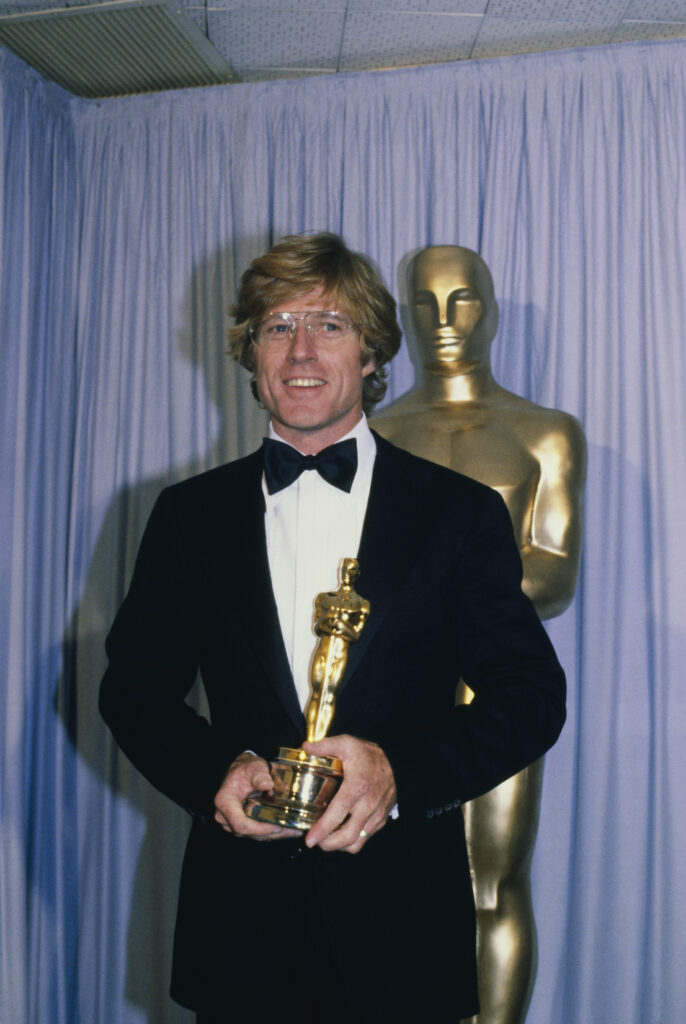 American actor Robert Redford holding his Oscar trophy backstage during the 53rd Annual Academy Awards at the Dorothy Chandler Pavilion in Los Angeles, California, March 31st 1981. He won the best director award for 'Ordinary People'. (Photo by UPI/Bettmann Archive/Getty Images)