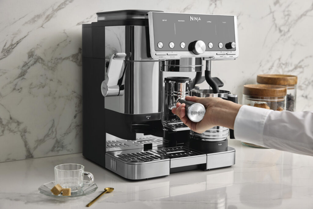 Person uses Ninja Luxe Café Pro Series for their coffee routine. Photo courtesy of NINJA.