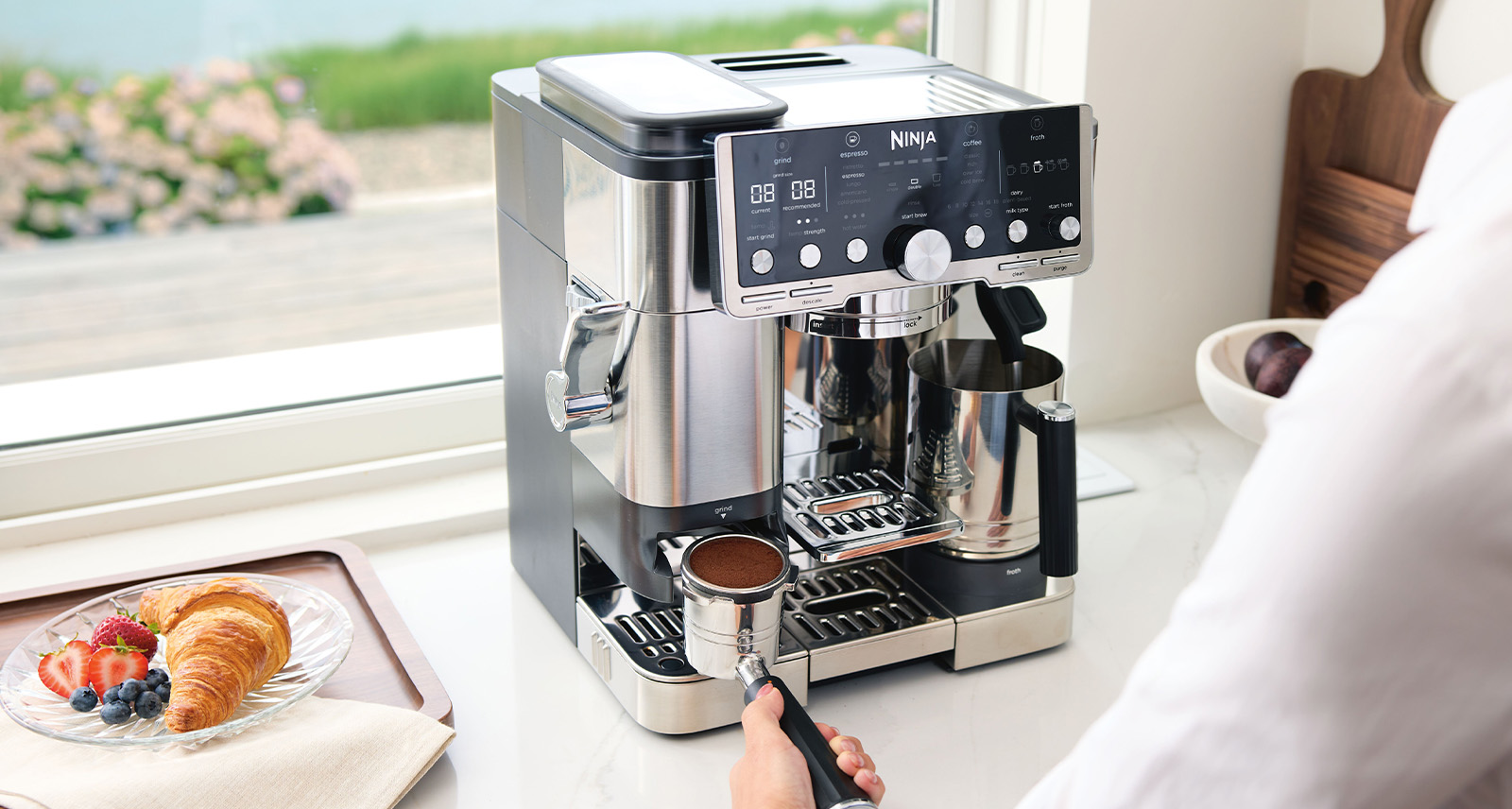 Person uses Ninja Luxe Café Pro Series for their coffee routine. Photo courtesy of NINJA.