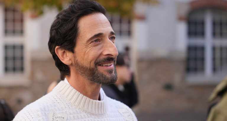 Oscar-winning actor Adrien Brody channels relaxed sophistication outside the Lacoste show, part of the brand’s sport-luxe Paris showcase. (photo: Edward Berthelot, Getty Images)