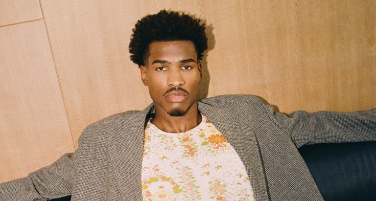 COAT, SHIRT, AND PANTS (ALL PRICE UPON REQUEST) BY PRADA.