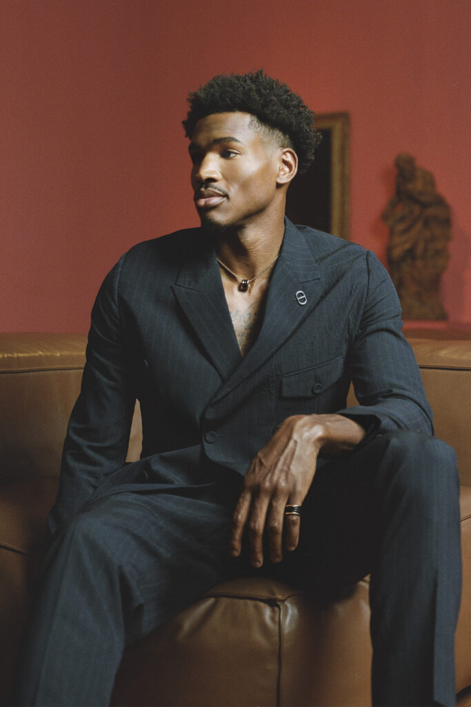 JACKET ($4,100) AND PANTS ($1,250) BY DIOR MEN;
RING ($2,170) AND NECKLACE ($5,750) BY BVLGARI.