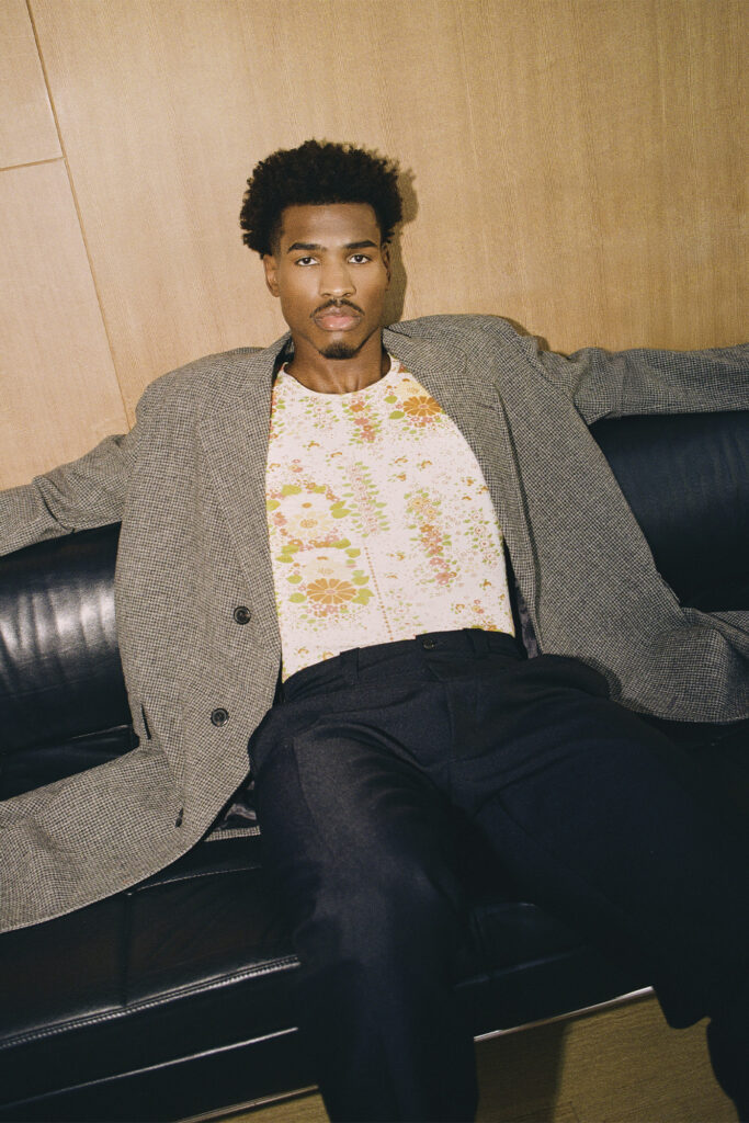 COAT, SHIRT, AND PANTS (ALL PRICE UPON REQUEST) BY PRADA.