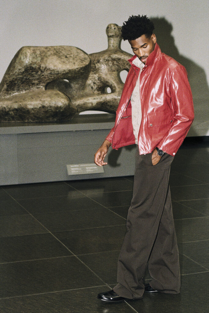 JACKET ($5,850), SWEATER ($2,425), TURTLENECK ($2,925) AND PANTS ($1,375) BY HERMÈS; SHOES ($1,500) BY LOUIS VUITTON MEN’S; WATCH ($10,800) BY OMEGA. HENRY MOORE. WORKING MODEL FOR UNESCO RECLINING FIGURE, 1957. ART GALLERY OF ONTARIO. GIFT OF HENRY MOORE, 1973. © THE HENRY MOORE FOUNDATION. 73/79.