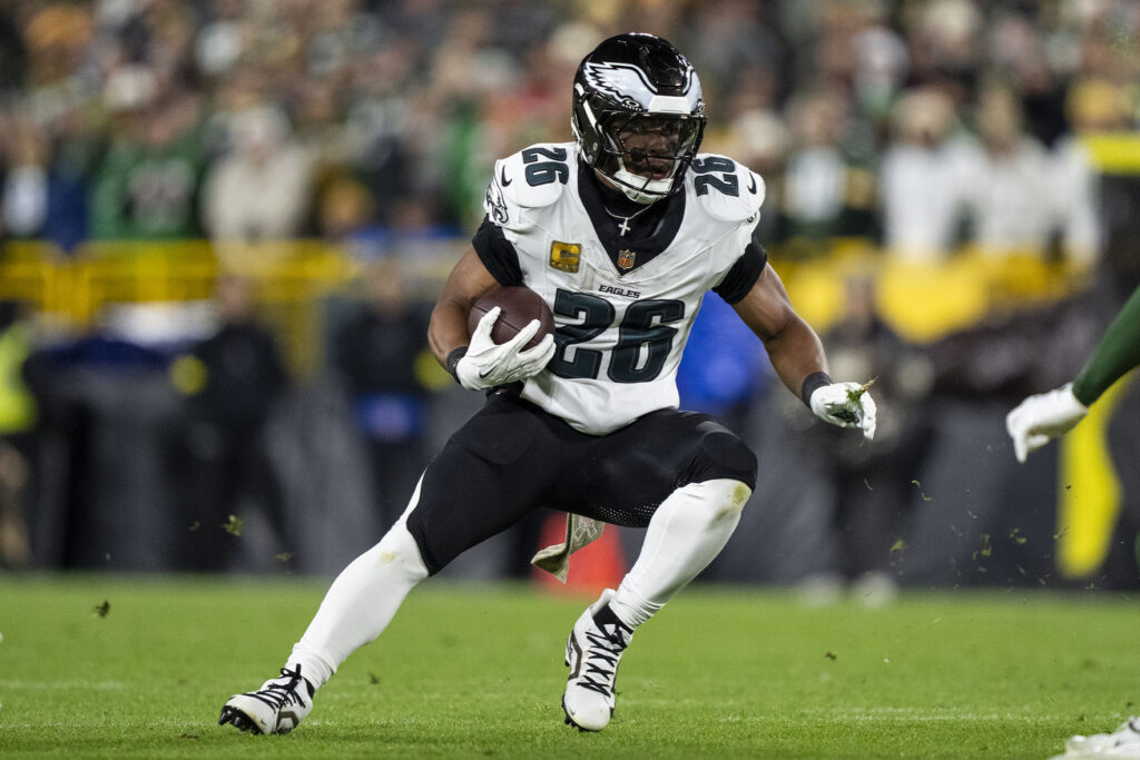 Saquon Barkley #26 of the Philadelphia Eagles runs with the ball during an NFL football game against the Green Bay Packers at Lambeau Field on November 10, 2025 in Green Bay, Wisconsin. (Photo by Michael Owens/Getty Images)