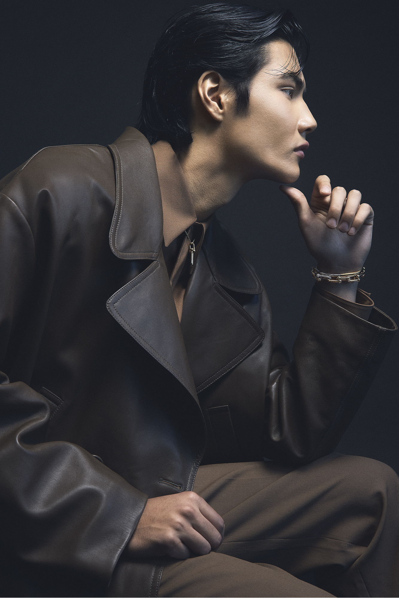 COAT ($14,200), SHIRT ($1,620), AND PANTS ($1,450) BY FENDI; NECKLACE ($4,650), TOP BRACELET ($7,000), AND BOTTOM BRACELET ($31,900) BY TIFFANY & CO.