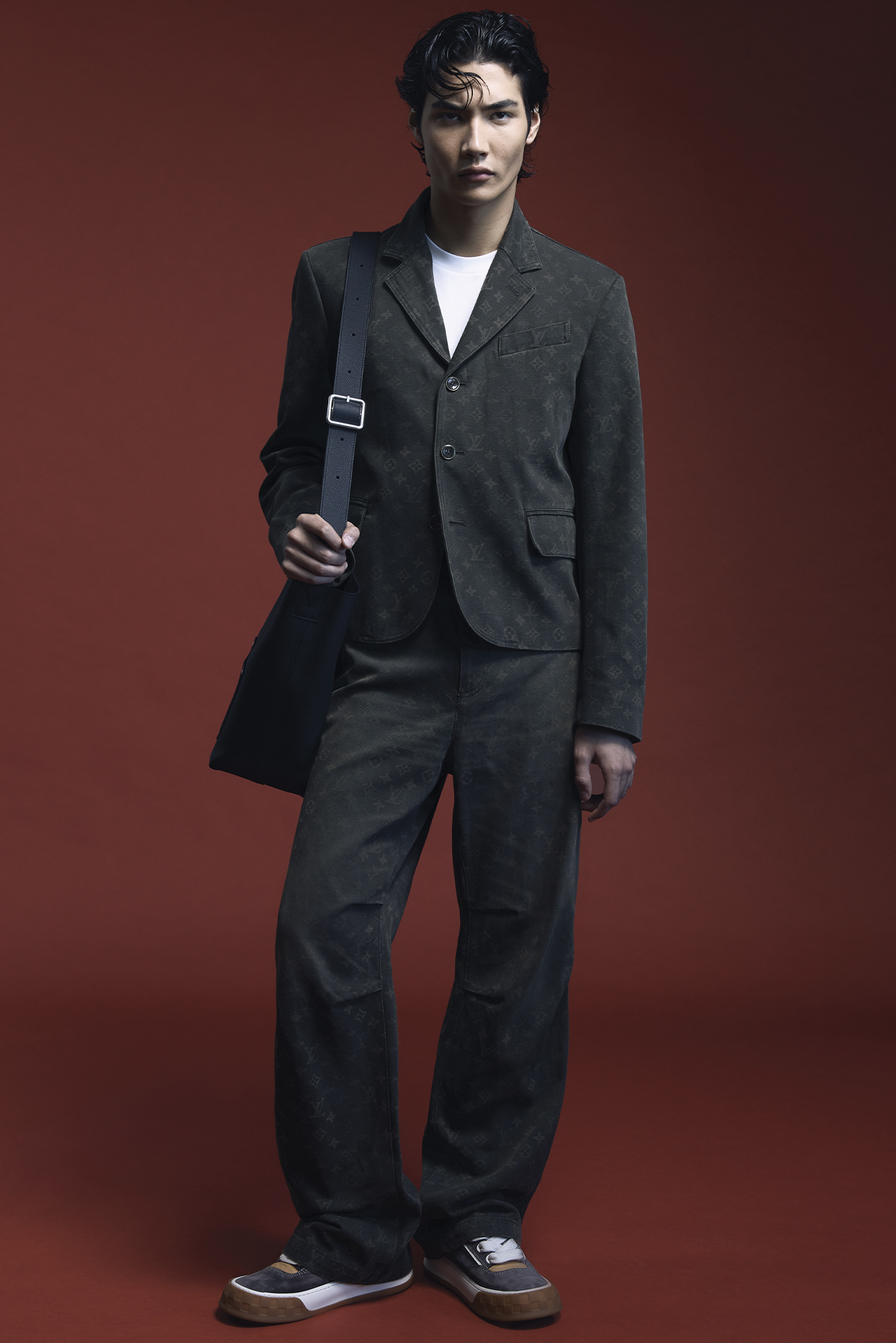 JACKET ($4,600), SHIRT ($1,190), PANTS ($3,000), SHOES ($1,400), AND BAG ($5,600) BY LOUIS VUITTON MEN’S.