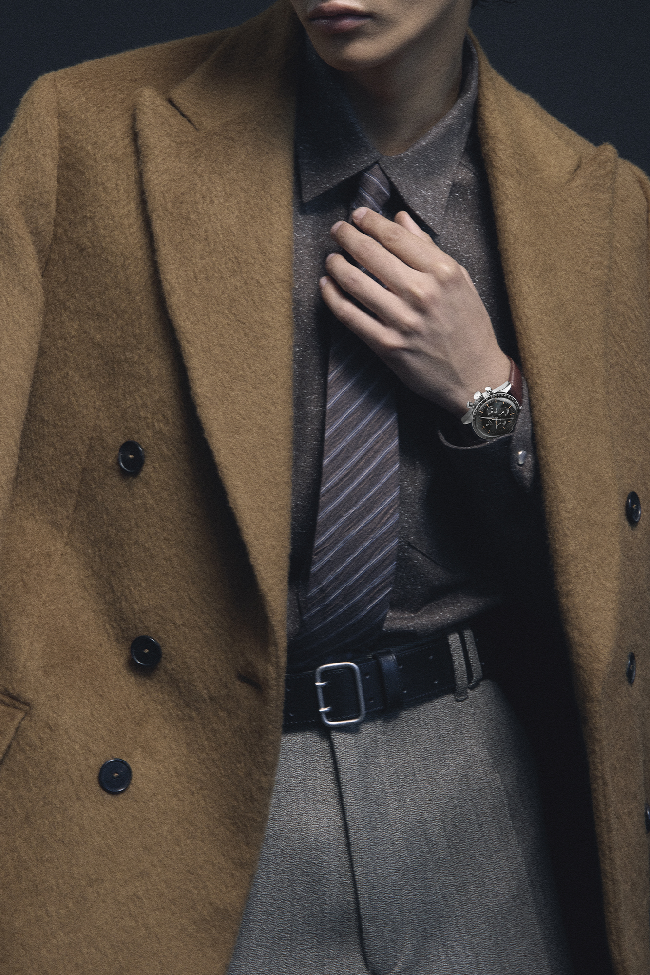 COAT ($2,199), SHIRT ($799), PANTS ($579), AND TIE ($180) BY ÉCOLE DE PENSÉE; BELT ($99) BY COS; WATCH ($10,800) BY OMEGA. Suzuki Kai men's style photoshoot shoot fashion trends for men