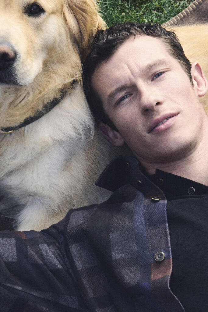 Callum Turner poses with golden retriever for LOUIS VUITTON MEN'S SS26 PRECOLLECTION DOG ACCESSORIES. PHOTO COURTESY OF LOUIS VUITTON.