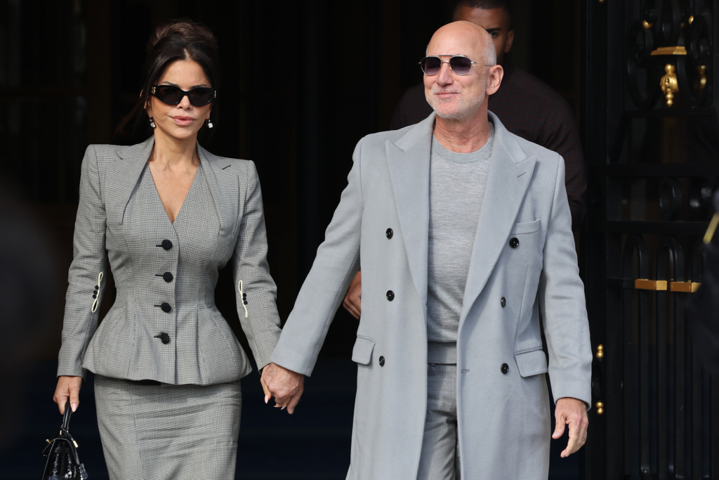PARIS, FRANCE - OCTOBER 04: Jeff Bezos and Lauren Sánchez Bezos leaving The Ritz during the Womenswear Spring Summer 2026 as part of Paris Fashion Week on October 04, 2025 in Paris, France. (Photo by Neil Mockford/Getty Images)